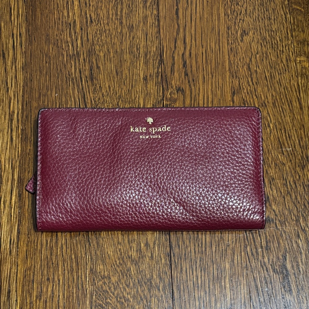 kate spade Burgundy Pebbled Leather Continental Wallet with Gold Logo